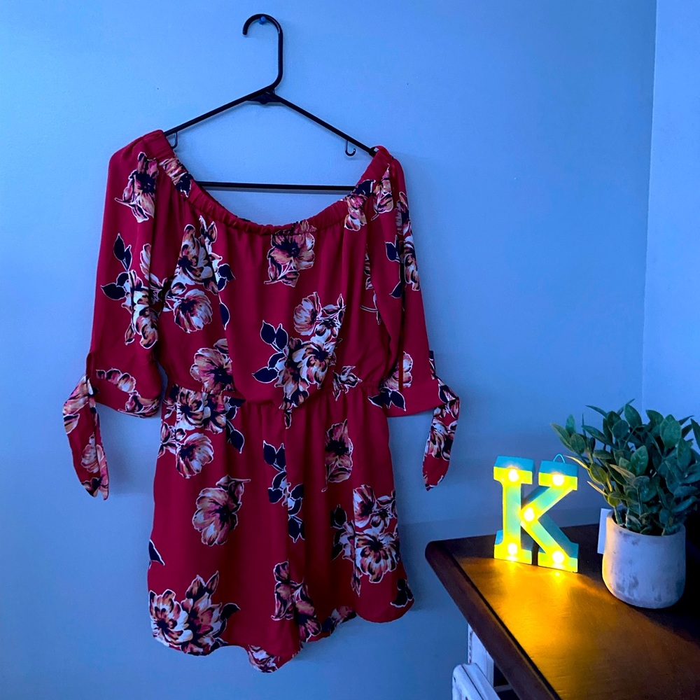 medium sized romper with flower design on it